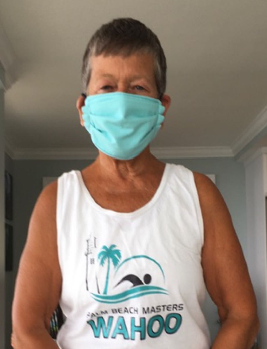 Swimmer Maureen wearing a mask on the pool deck