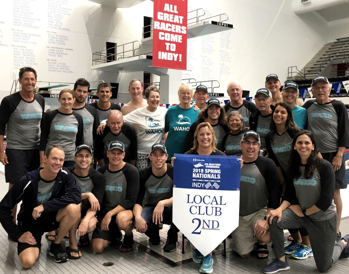 Palm Beach Masters swimmers holding the 2018 USMS Spring Nationals 2nd place Local Club banner in Indianapolis