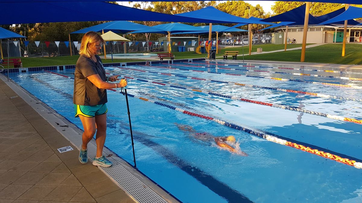 Coach Linda filming a swimmer for Swim Smooth video analysis in Perth, Australia